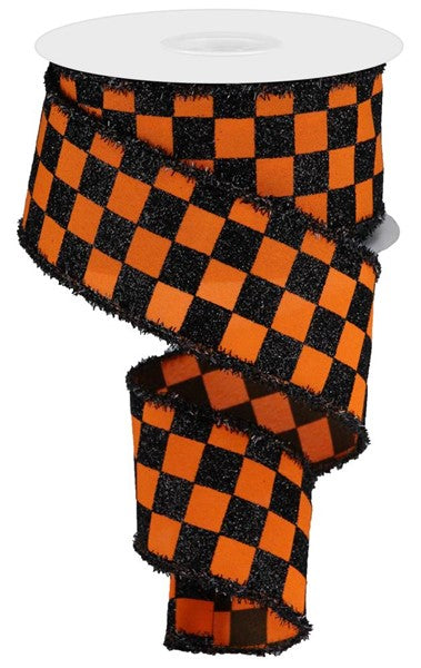 a roll of orange and black checkered ribbon