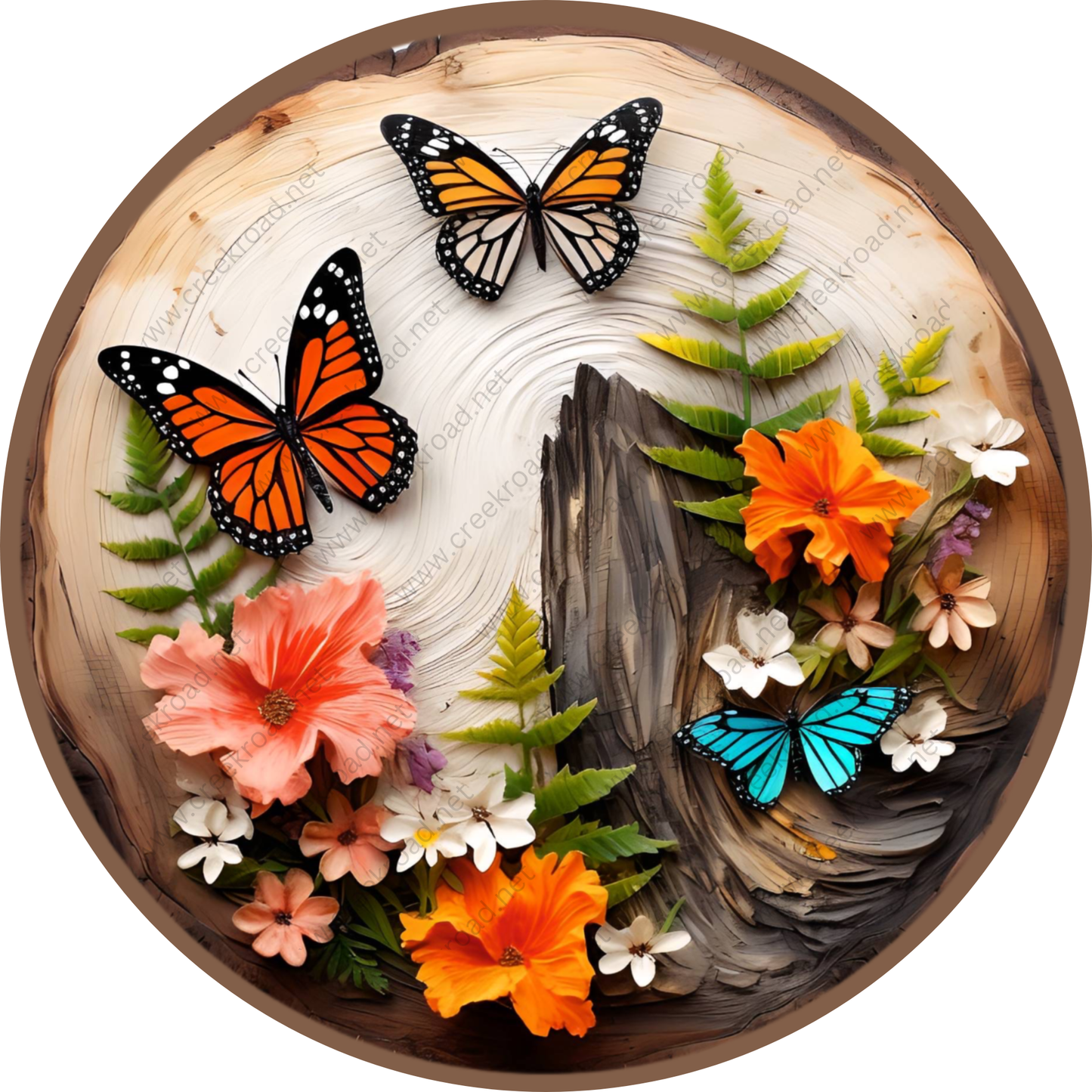 A circular arrangement of various flowers, leaves, and butterflies on a wooden surface.