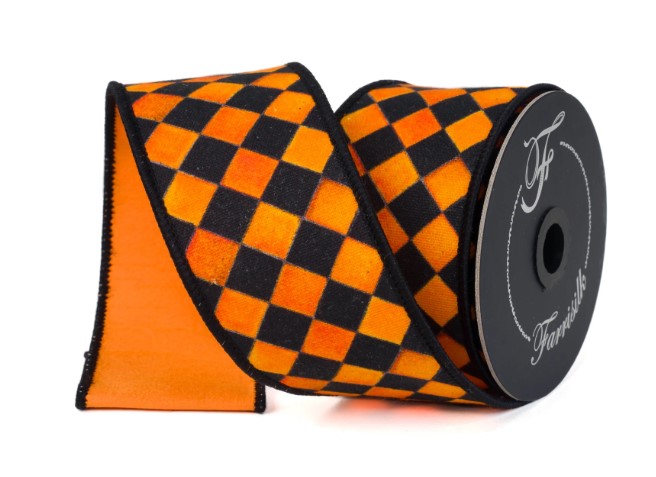 A roll of orange and black checkered ribbon with a black and white pattern.