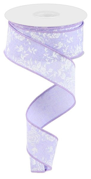 a purple ribbon with white flowers on it