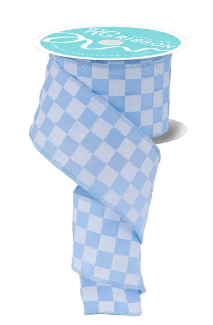 A roll of blue and white checkered ribbon with a label that reads "The Ribbon" on it.