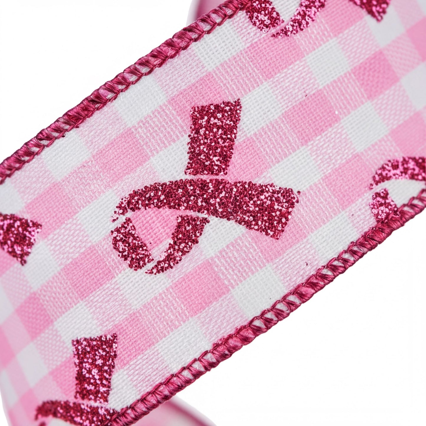 a close-up view of a pink and white checkered ribbon with a glittery design.