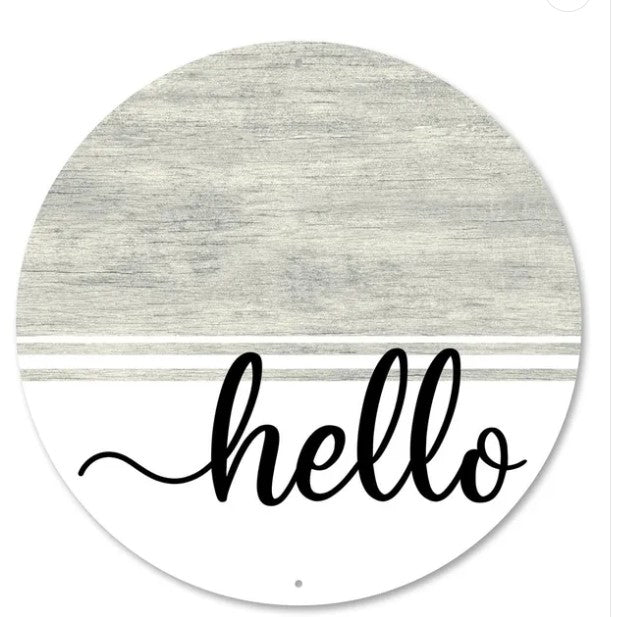 A round, white sign with a gray background and the word "Hello" written in a cursive font.