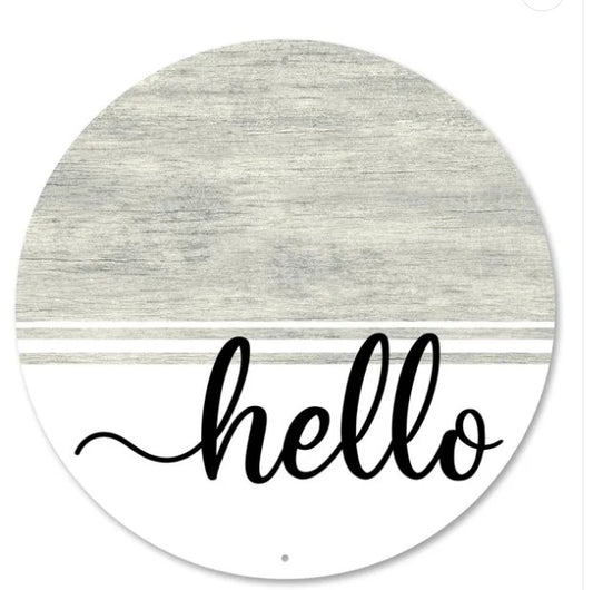 A round, white sign with a gray background and the word "Hello" written in a cursive font.