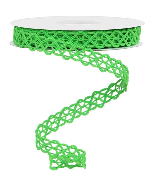 a spool of green ribbon on a white background