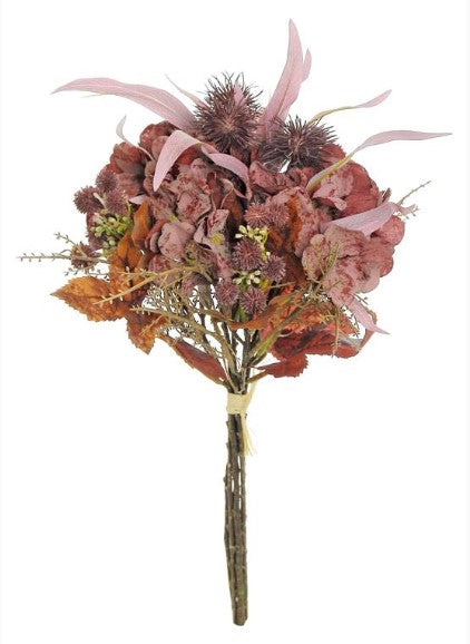 A bouquet of dried flowers, including purple and red blooms, along with some leaves, tied together with a twine.