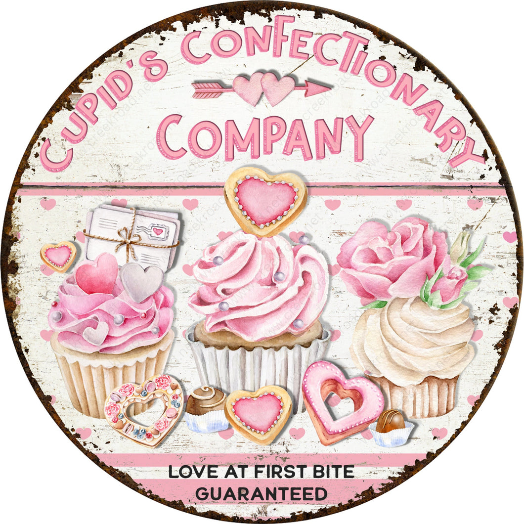 Cupid's Confectionary Company Love At First Bite Guaranteed-Wreath Sign-Aluminum-Valentines-Decor